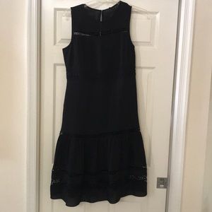Black sleeveless dress. Lined to knee. Size 8.